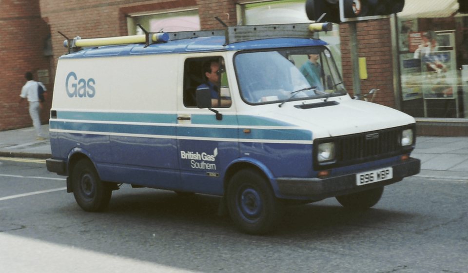 A blue and white British Gas Southern van parked on a London street.
